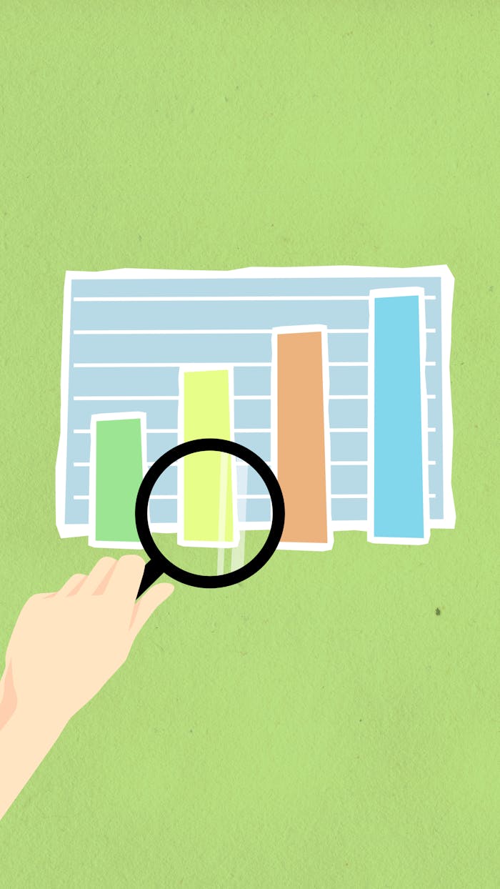 home-services-004 Top view of decorative cardboard illustration of hand with magnifying glass above diagram with columns on green background